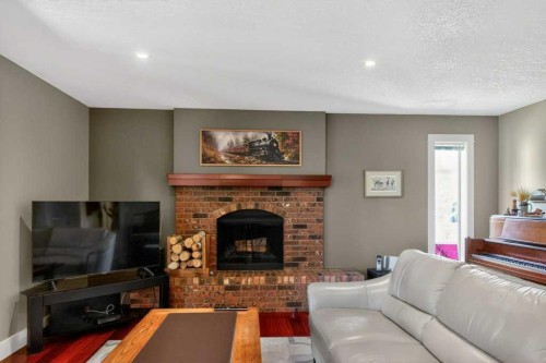 63 Wildwood Crescent West, Lethbridge, AB - Indoor Photo Showing Living Room With Fireplace