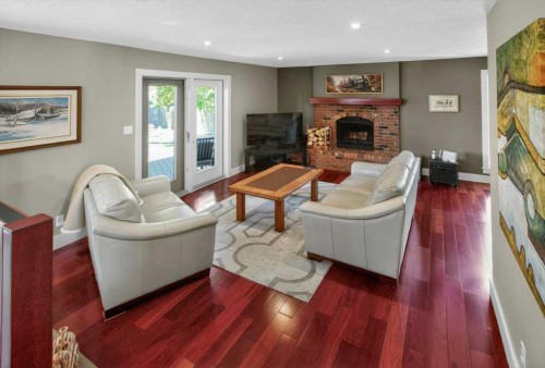 63 Wildwood Crescent West, Lethbridge, AB - Indoor Photo Showing Living Room With Fireplace