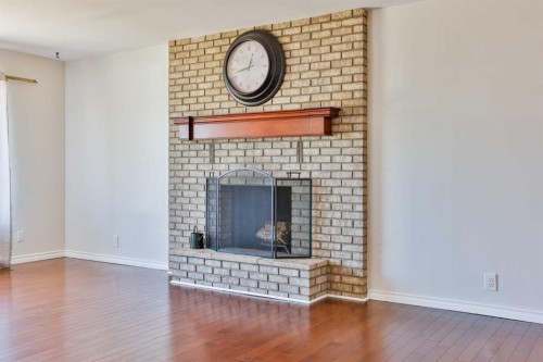96 Oxford Road West, Lethbridge, AB - Indoor Photo Showing Living Room With Fireplace