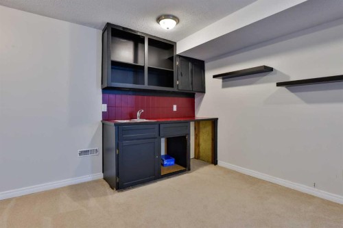 96 Oxford Road West, Lethbridge, AB - Indoor Photo Showing Other Room With Fireplace