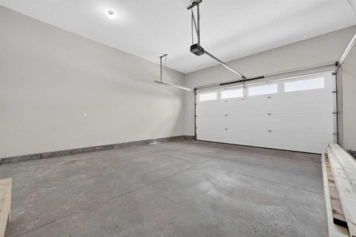 74 Riverpark Boulevard West, Lethbridge, AB - Indoor Photo Showing Garage
