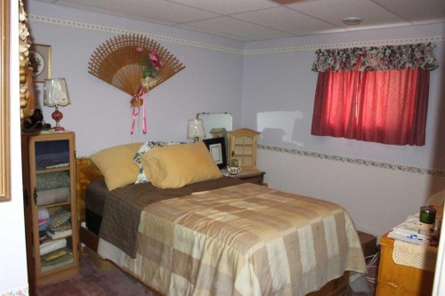 61048 Hwy 844, Raymond, AB - Indoor Photo Showing Bedroom