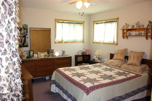 61048 Hwy 844, Raymond, AB - Indoor Photo Showing Bedroom