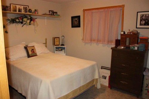 61048 Hwy 844, Raymond, AB - Indoor Photo Showing Bedroom
