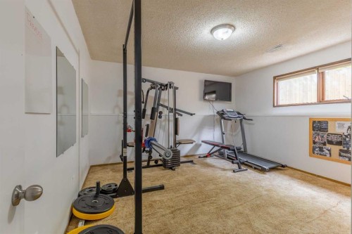 130 Chippewa Crescent West, Lethbridge, AB - Indoor Photo Showing Gym Room