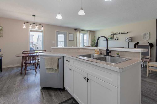 1-4406 Lake Drive, Coalhurst, AB - Indoor Photo Showing Kitchen With Double Sink