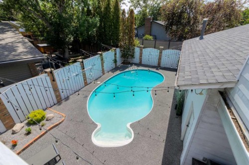 80 Lafayette Boulevard West, Lethbridge, AB - Outdoor With In Ground Pool