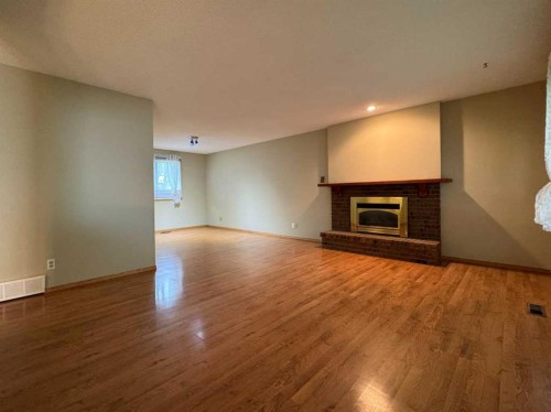 2409 20 Street North, Lethbridge, AB - Indoor Photo Showing Other Room With Fireplace