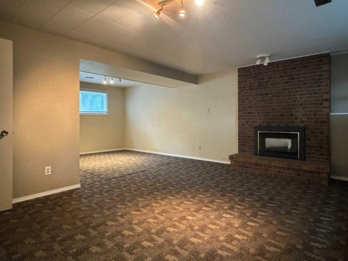 2409 20 Street North, Lethbridge, AB - Indoor Photo Showing Other Room With Fireplace