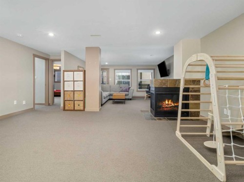 275 Mt Sunburst Way West, Lethbridge, AB - Indoor Photo Showing Other Room With Fireplace