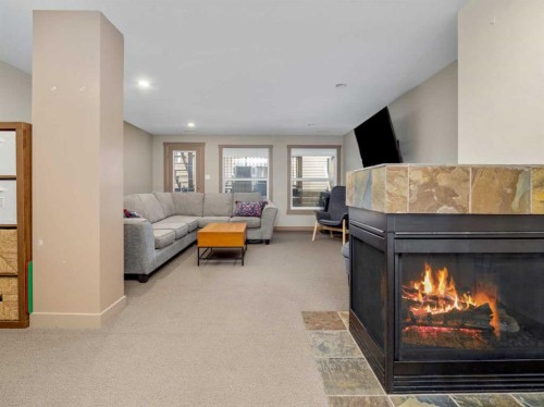 275 Mt Sunburst Way West, Lethbridge, AB - Indoor Photo Showing Living Room With Fireplace