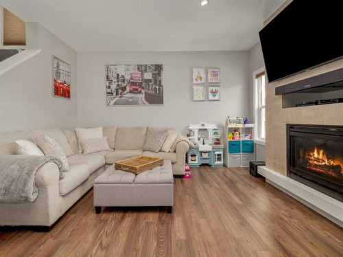 386 Moonlight Way West, Lethbridge, AB - Indoor Photo Showing Living Room With Fireplace