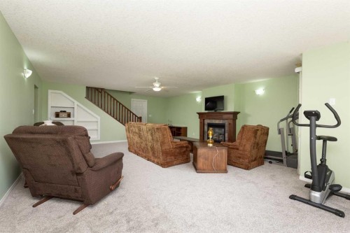 334 Mt Sunburst Way West, Lethbridge, AB - Indoor With Fireplace