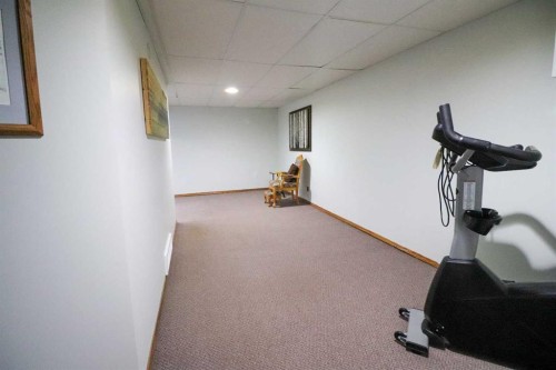 186 8 Street West, Cardston, AB - Indoor Photo Showing Gym Room
