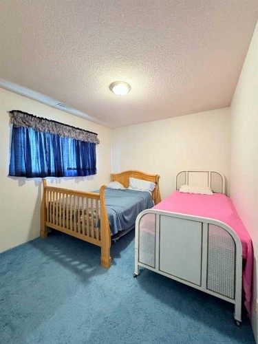 737 2 Street West, Cardston, AB - Indoor Photo Showing Bedroom