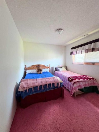 737 2 Street West, Cardston, AB - Indoor Photo Showing Bedroom
