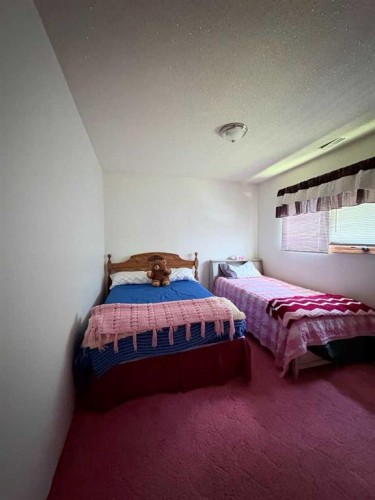 737 2 Street West, Cardston, AB - Indoor Photo Showing Bedroom