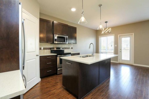 59 Lasalle Road West, Lethbridge, AB - Indoor Photo Showing Kitchen With Double Sink With Upgraded Kitchen