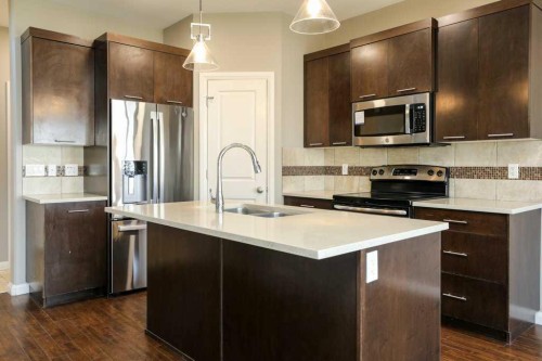 59 Lasalle Road West, Lethbridge, AB - Indoor Photo Showing Kitchen With Double Sink With Upgraded Kitchen