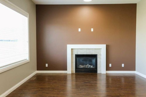 59 Lasalle Road West, Lethbridge, AB - Indoor Photo Showing Living Room With Fireplace