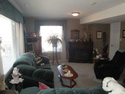 94 Heritage Lane West, Lethbridge, AB - Indoor Photo Showing Living Room With Fireplace