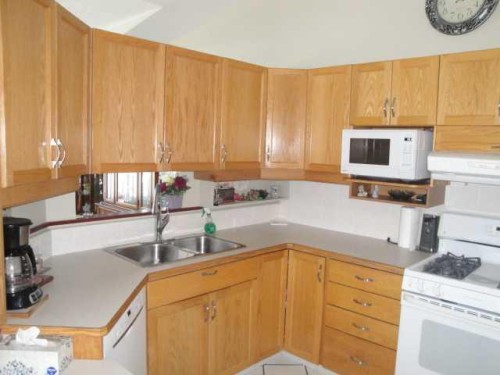 94 Heritage Lane West, Lethbridge, AB - Indoor Photo Showing Kitchen With Double Sink