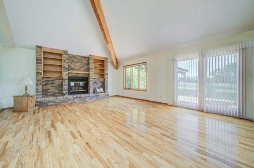 23 Niska Place West, Lethbridge, AB - Indoor Photo Showing Living Room With Fireplace