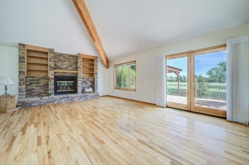 23 Niska Place West, Lethbridge, AB - Indoor Photo Showing Living Room With Fireplace