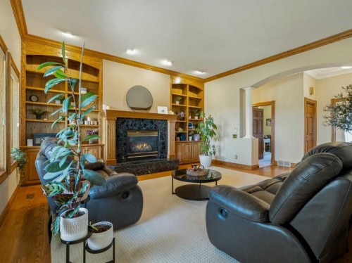 90013 212, Rural Lethbridge County, AB - Indoor Photo Showing Living Room With Fireplace
