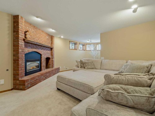 90013 212, Rural Lethbridge County, AB - Indoor Photo Showing Living Room With Fireplace