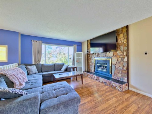 8534 21 Avenue, Coleman, AB - Indoor Photo Showing Living Room With Fireplace