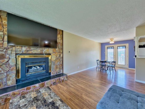 8534 21 Avenue, Coleman, AB - Indoor Photo Showing Living Room With Fireplace