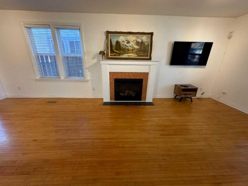 721 6 Street South, Lethbridge, AB - Indoor Photo Showing Living Room With Fireplace