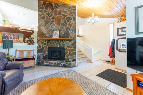 210 Ojibwa Place West, Lethbridge, AB - Indoor Photo Showing Living Room With Fireplace
