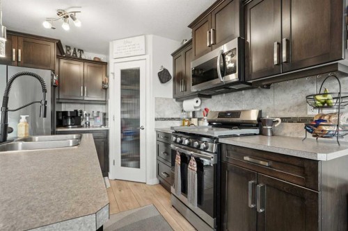 648 Parkside Green, Coaldale, AB - Indoor Photo Showing Kitchen With Double Sink