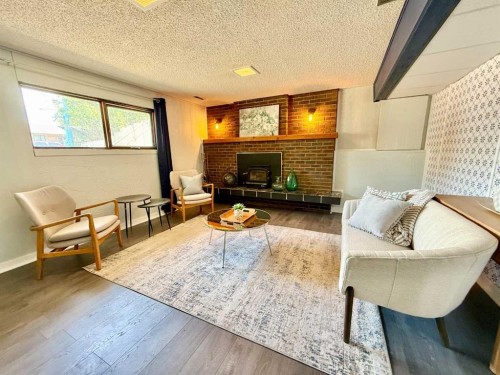 221 Mcdermott Road, Coalhurst, AB - Indoor Photo Showing Living Room With Fireplace