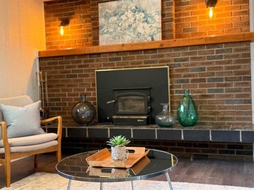 221 Mcdermott Road, Coalhurst, AB - Indoor Photo Showing Living Room With Fireplace