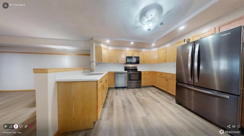 104-75 1 Avenue South, Lethbridge, AB - Indoor Photo Showing Kitchen With Stainless Steel Kitchen