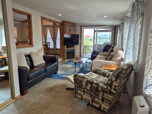 30 Mount Vista Drive, Cardston, AB - Indoor Photo Showing Living Room With Fireplace