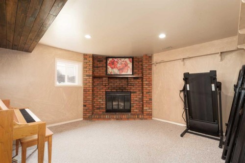 258 Mcdermott Road, Coalhurst, AB - Indoor Photo Showing Other Room With Fireplace