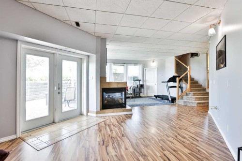 406 Meadow Lark Drive, Rural Lethbridge County, AB - Indoor With Fireplace