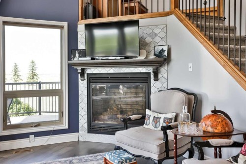 406 Meadow Lark Drive, Rural Lethbridge County, AB - Indoor Photo Showing Living Room With Fireplace