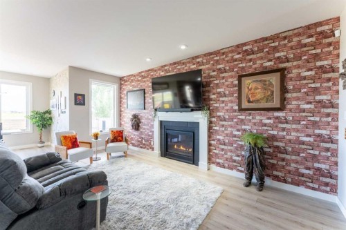 437 Devonia Way West, Lethbridge, AB - Indoor Photo Showing Living Room With Fireplace