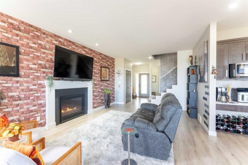 437 Devonia Way West, Lethbridge, AB - Indoor Photo Showing Living Room With Fireplace