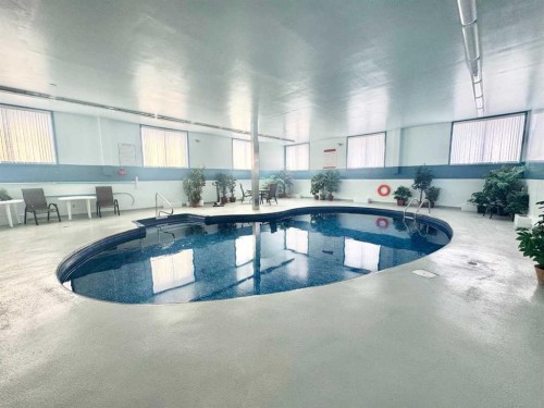 304-65 Temple Boulevard West, Lethbridge, AB - Indoor Photo Showing Other Room With In Ground Pool