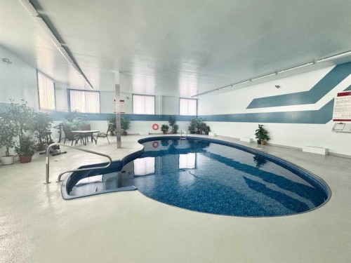 304-65 Temple Boulevard West, Lethbridge, AB - Indoor Photo Showing Other Room With In Ground Pool