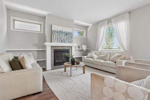 409 Devonia Way West, Lethbridge, AB - Indoor Photo Showing Living Room With Fireplace