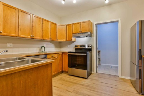 3-129 Silkstone Road West, Lethbridge, AB - Indoor Photo Showing Kitchen With Stainless Steel Kitchen With Double Sink