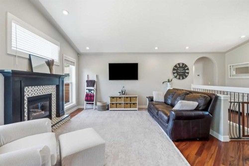 14 Lloyd Crescent Ne, Langdon, AB - Indoor Photo Showing Living Room With Fireplace