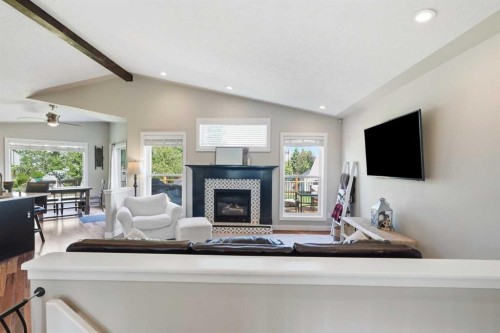 14 Lloyd Crescent Ne, Langdon, AB - Indoor Photo Showing Living Room With Fireplace